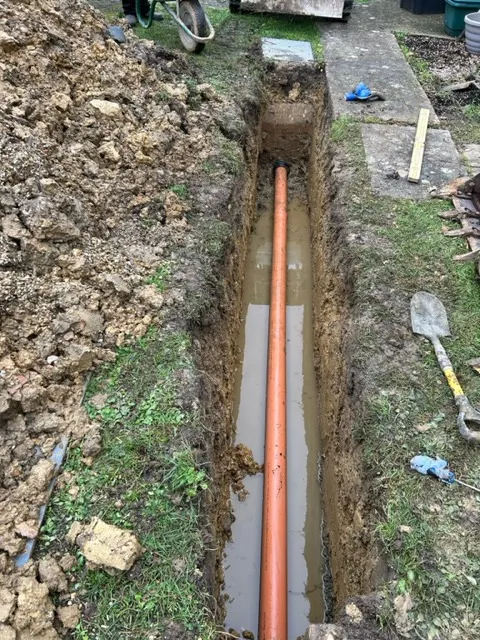 drain being layed in the ground